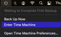 Select enter time machine to retrieve deleted files on mac